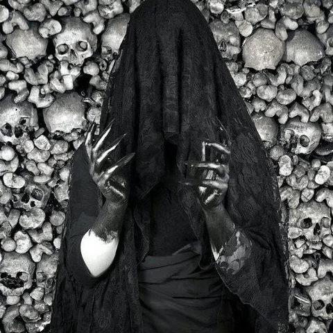 Veiled Figure among Skulls