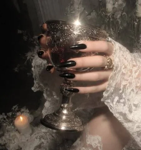 Dark Nails Holding a Goblet