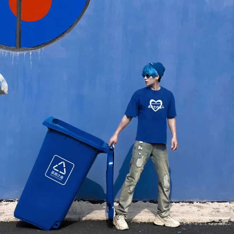 Playful Poses Against a Blue City Wall — Matching Avatars · Left