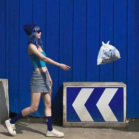 Playful Poses Against a Blue City Wall — Matching Avatars · Right